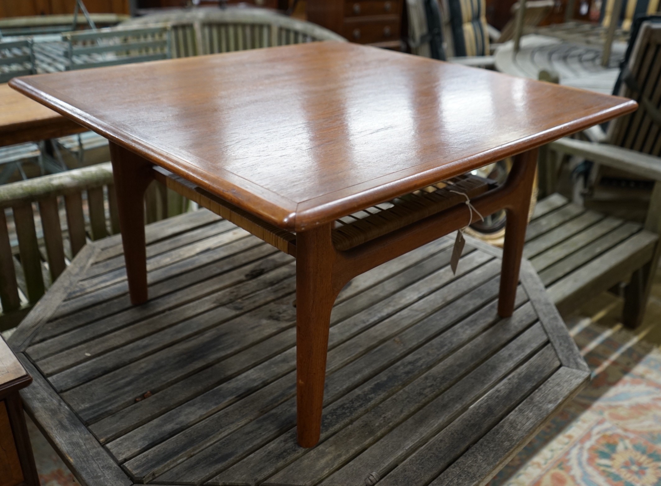 A mid century design Trioh Mobler Danish square teak coffee table with cane undertier, width 74cm, height 42cm